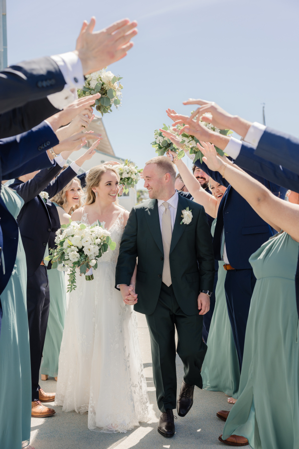 Wedding party celebration with greenery and white florals