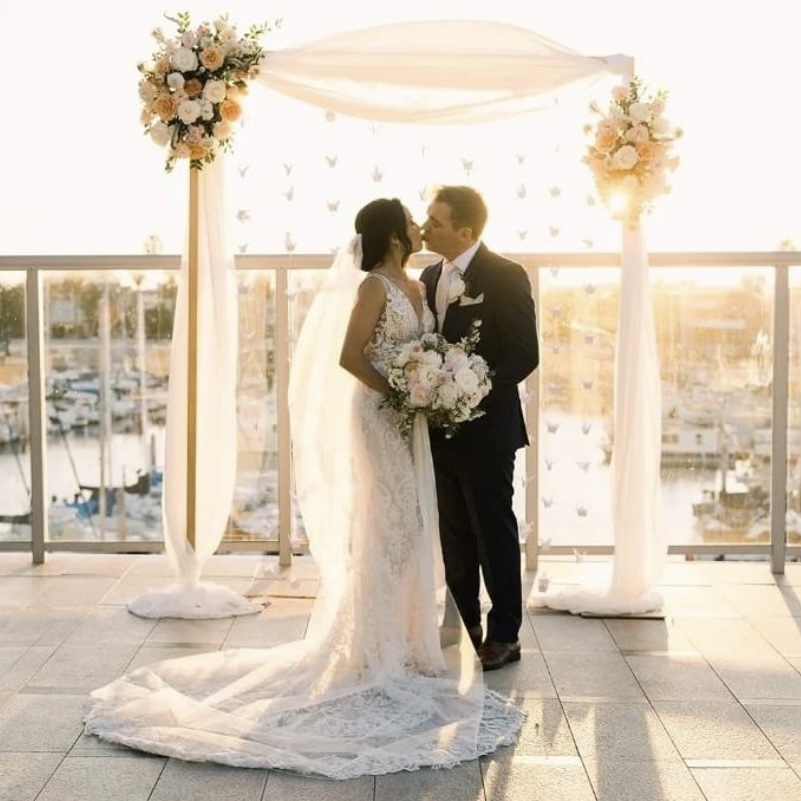 Beachside ceremony under a floral chuppah in Manhattan Beach