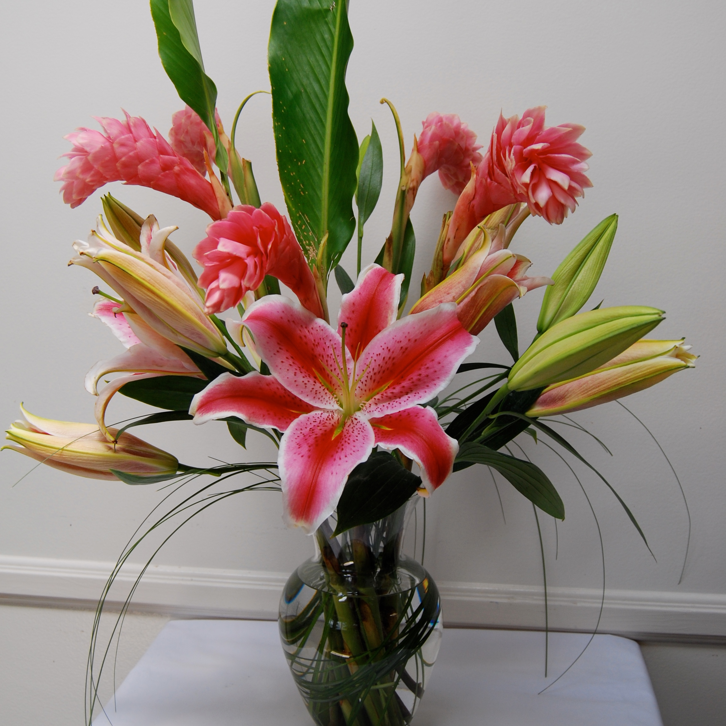 Stargazer lily and pink ginger tropical arrangement